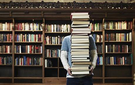 Librarian With a Pile of Books